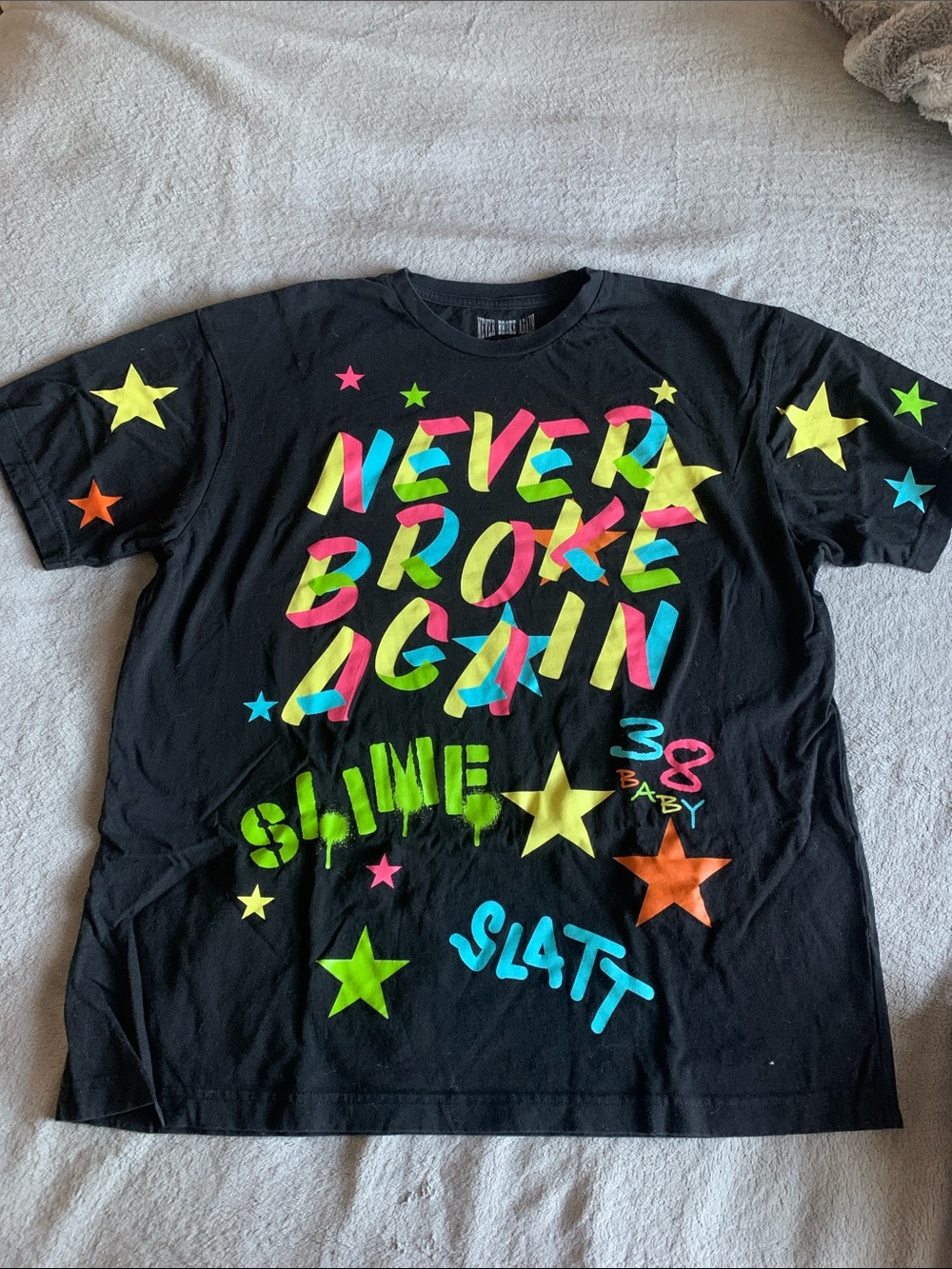 Black Short-Sleeve Graphic Tee with Neon Star Print